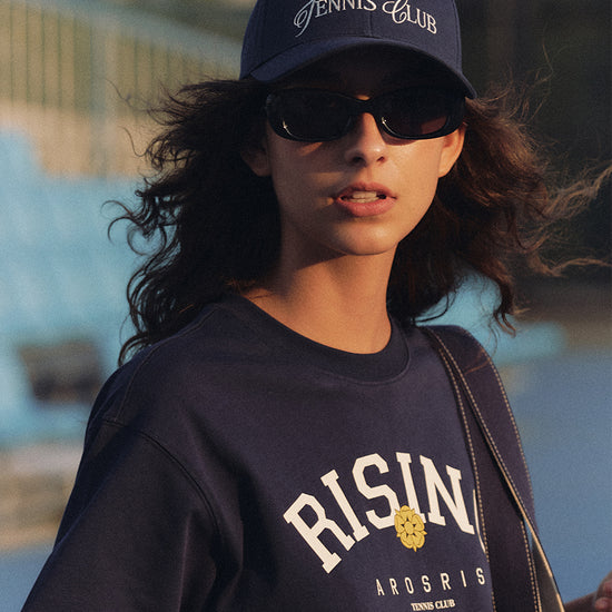 AROSRIS Vintage Dad Hat in Classic Navy — full body lifestyle shot showing structured cotton twill and adjustable back strap
