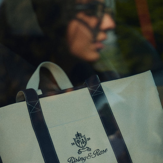 Close-up of AROSRIS Heritage Canvas Tote — showing signature heritage embroidery detail and heavyweight cotton canvas texture