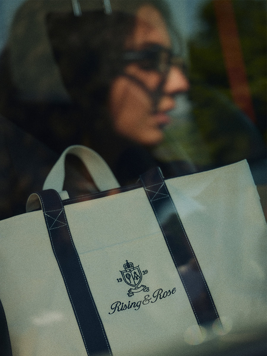 Close-up of AROSRIS Heritage Canvas Tote — showing signature heritage embroidery detail and heavyweight cotton canvas texture