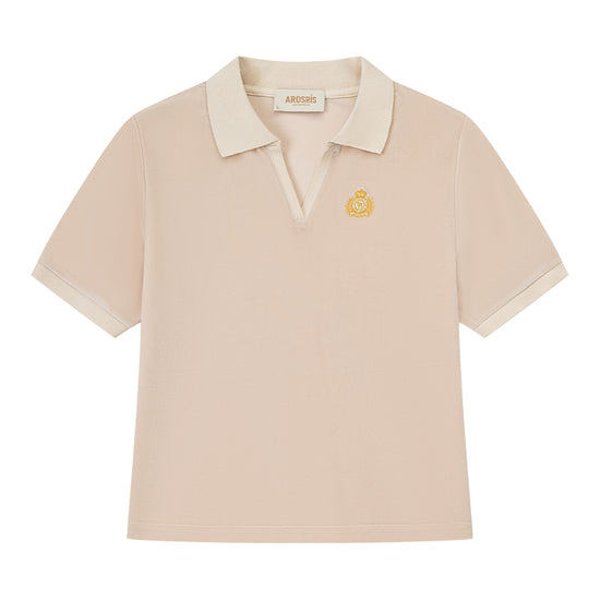 AROSRIS Holiday Velvet Badge Polo in cream — flat lay showing soft velour texture and badge logo embroidery chest detail