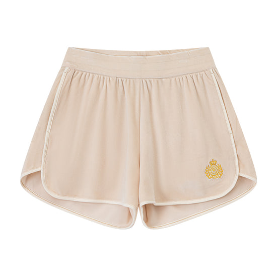 AROSRIS Holiday Velvet Shorts in cream — flat lay showing soft velour fabric, rolled hem detail and badge embroidery