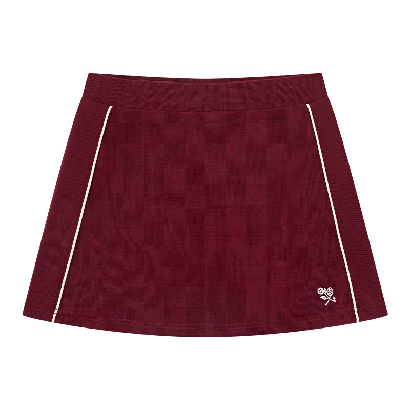 AROSRIS Tennis Club Waffle Knit Skort in Passion Red — flat lay showing 3D waffle texture and A-line cut