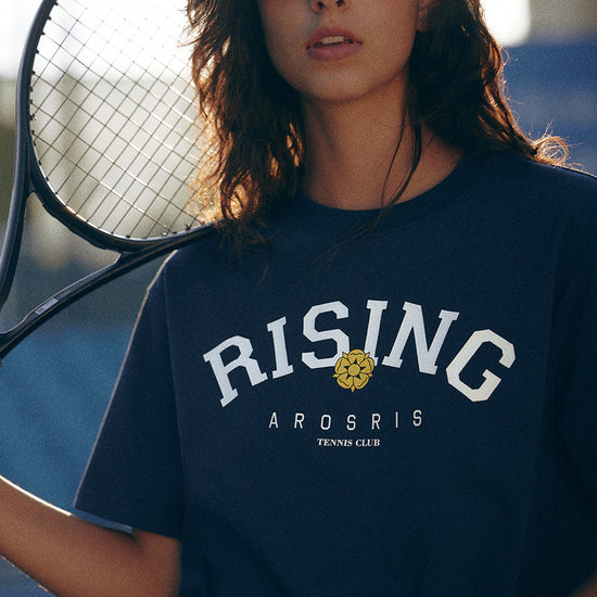 AROSRIS Retro Rising Tennis Club Graphic Tee in Classic Navy — close-up showing bold varsity collegiate print and long-staple cotton texture