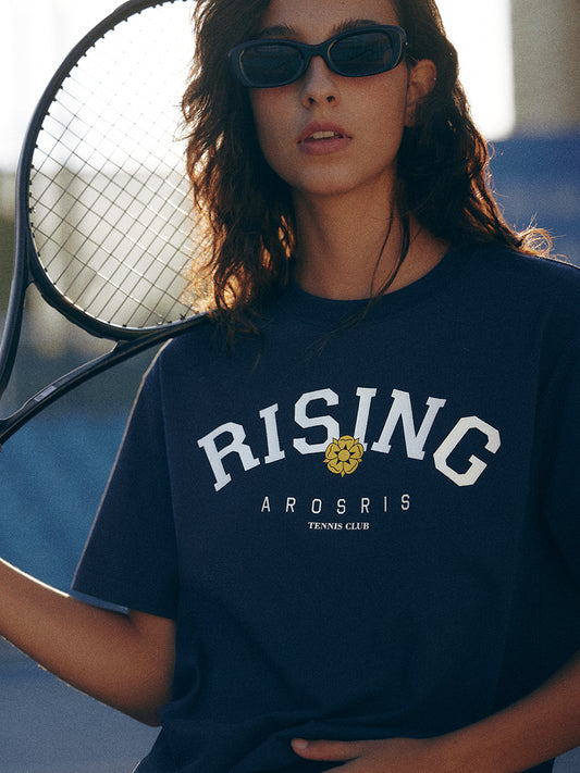 AROSRIS Retro Rising Tennis Club Graphic Tee in Classic Navy — close-up showing bold varsity collegiate print and long-staple cotton texture