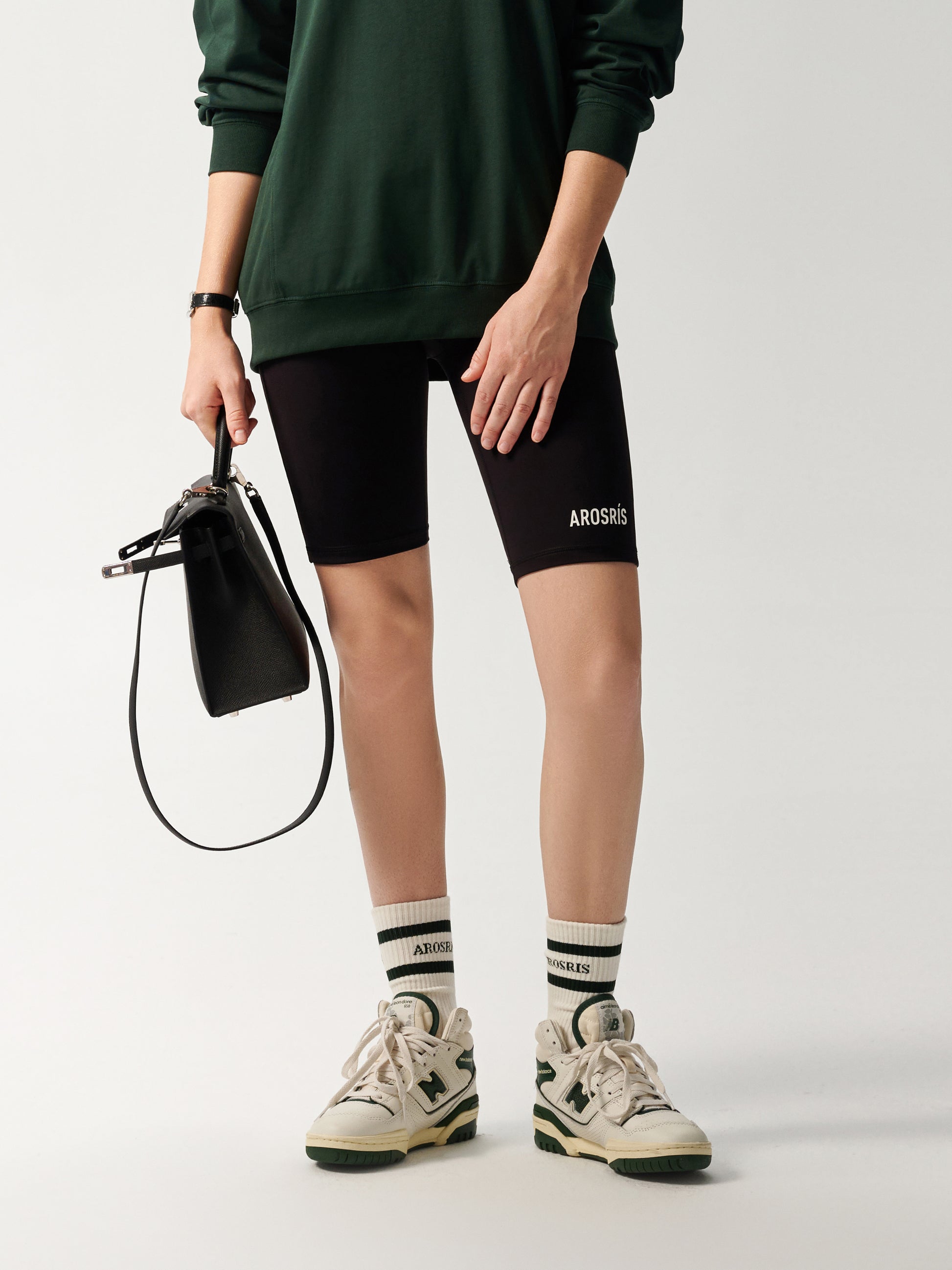 AROSRIS Naked Feel Compression Shorts in Midnight Black — active lifestyle shot showing 4-way stretch and body-sculpting fit