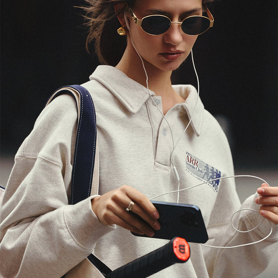 AROSRIS Tennis Club Retro Cotton Polo Sweatshirt in Oatmeal Heather — close-up showing polo collar detail and vintage collegiate graphic