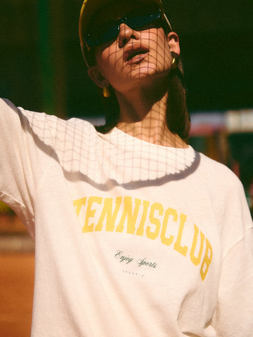 AROSRIS Tennis Club Sheer Texture Graphic Tee in Midsummer White — close-up showing vintage collegiate lettering and snowflake cotton texture