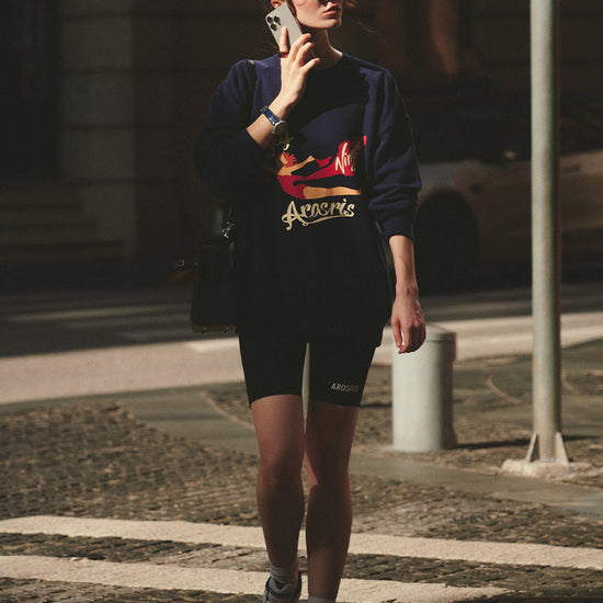 AROSRIS The Princess Fly Arosris Crewneck in Royal Navy — front view showing retro poster graphic print and relaxed oversized fit