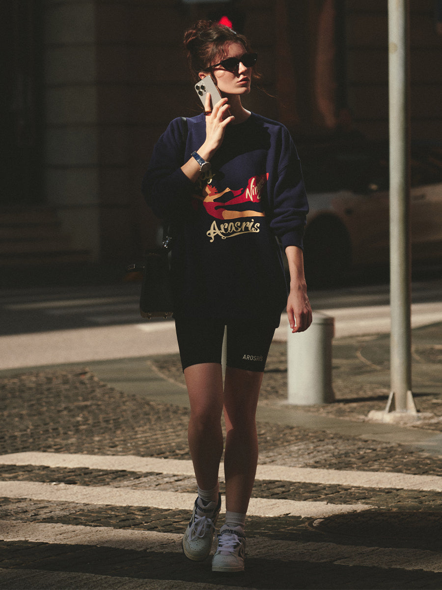 AROSRIS The Princess Fly Arosris Crewneck in Royal Navy — front view showing retro poster graphic print and relaxed oversized fit