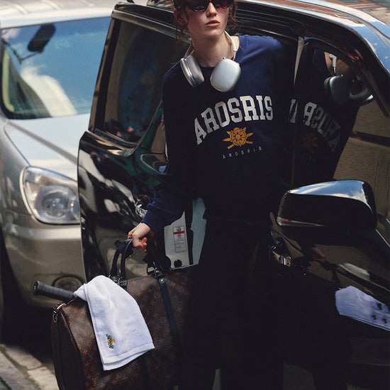 AROSRIS The Princess Retro Crest Pullover — full body street style showing oversized silhouette and vintage varsity crest graphic