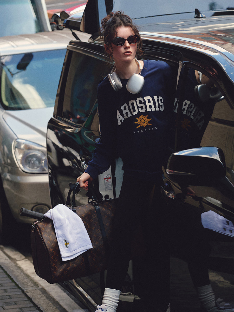 AROSRIS The Princess Retro Crest Pullover — full body street style showing oversized silhouette and vintage varsity crest graphic