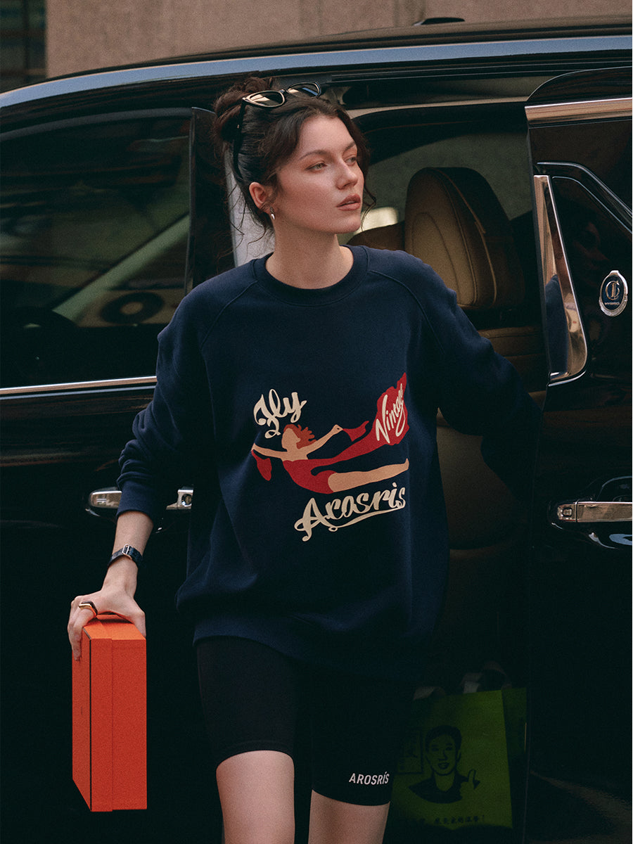 AROSRIS The Princess Retro Crewneck in Royal Navy — styled with biker shorts showing 90s off-duty aesthetic