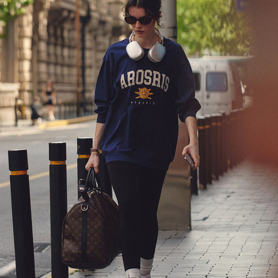 AROSRIS The Princess Retro Pullover in Royal Navy — outdoor street style showing relaxed bum-covering length and crest print