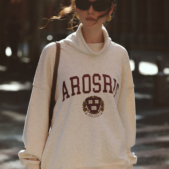 AROSRIS The Princess Mock Neck Sweatshirt in Royal Navy — outdoor lifestyle shot showing mock neck design and relaxed oversized drape