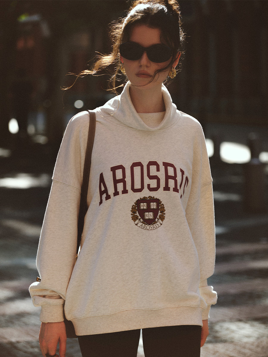 AROSRIS The Princess Mock Neck Sweatshirt in Royal Navy — outdoor lifestyle shot showing mock neck design and relaxed oversized drape