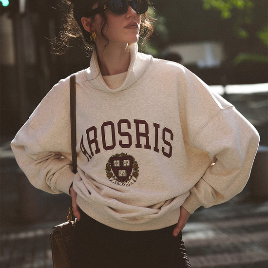 AROSRIS The Princess Varsity Sweatshirt in Varsity Grey — front view showing retro Ivy League crest print and voluminous fit
