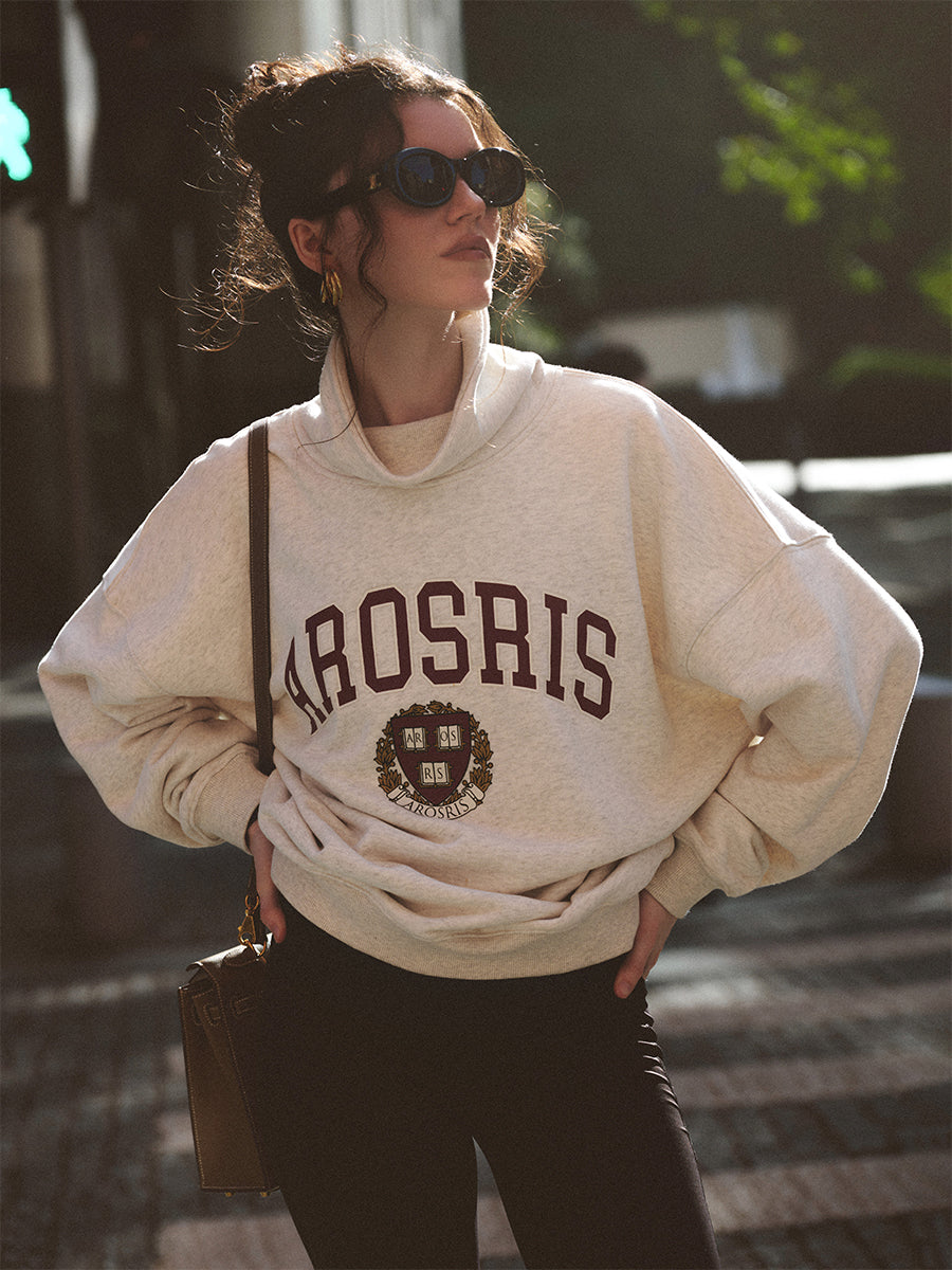 AROSRIS The Princess Varsity Sweatshirt in Varsity Grey — front view showing retro Ivy League crest print and voluminous fit