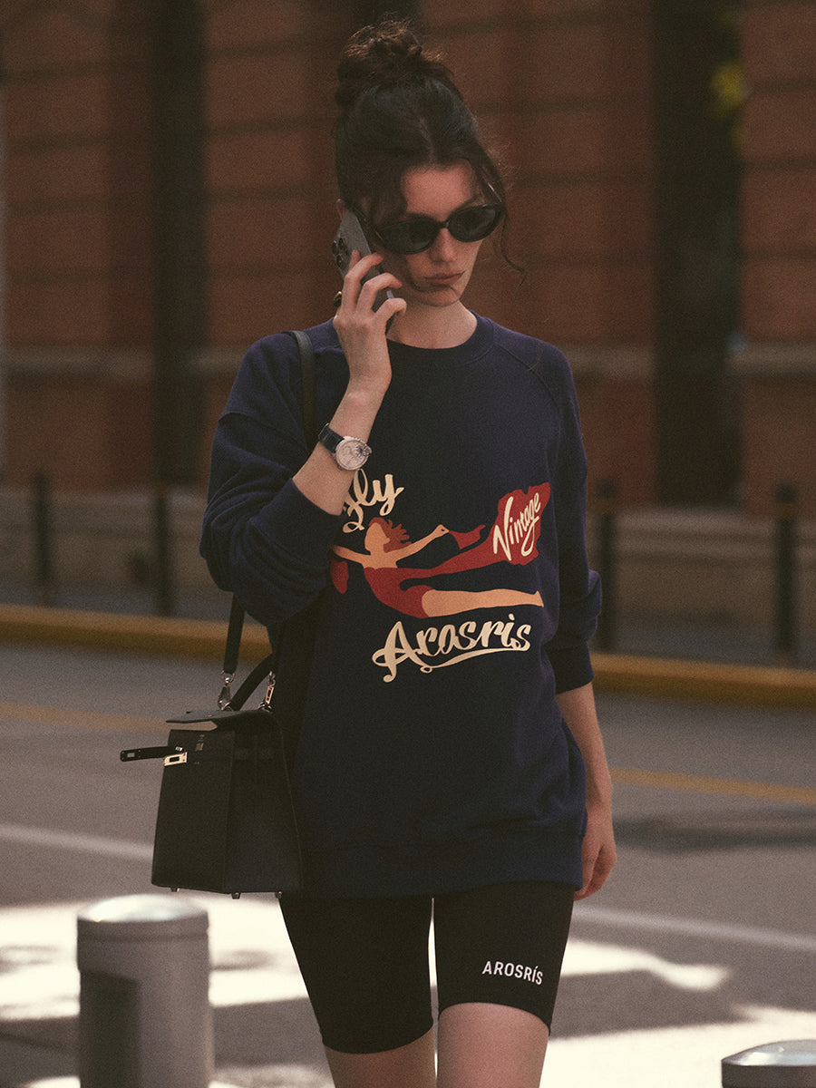 AROSRIS The Princess Retro Graphic Crewneck in Royal Navy — full body street style showing Fly Arosris vintage artwork and oversized silhouette