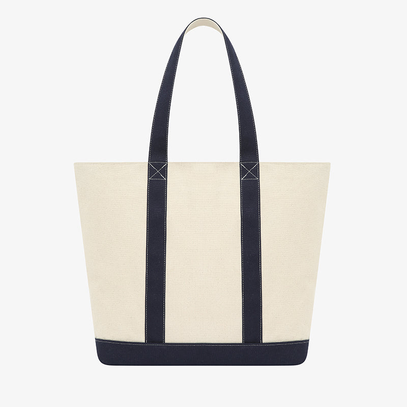 AROSRIS Heritage Tote embroidery close-up — showing collegiate heritage logo detail on natural canvas fabric