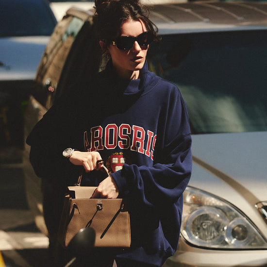 AROSRIS The Princess Mock Neck Sweatshirt styled with straight leg pants — showing 90s off-duty collegiate aesthetic