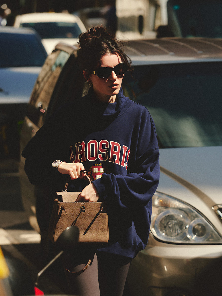 AROSRIS The Princess Mock Neck Sweatshirt styled with straight leg pants — showing 90s off-duty collegiate aesthetic