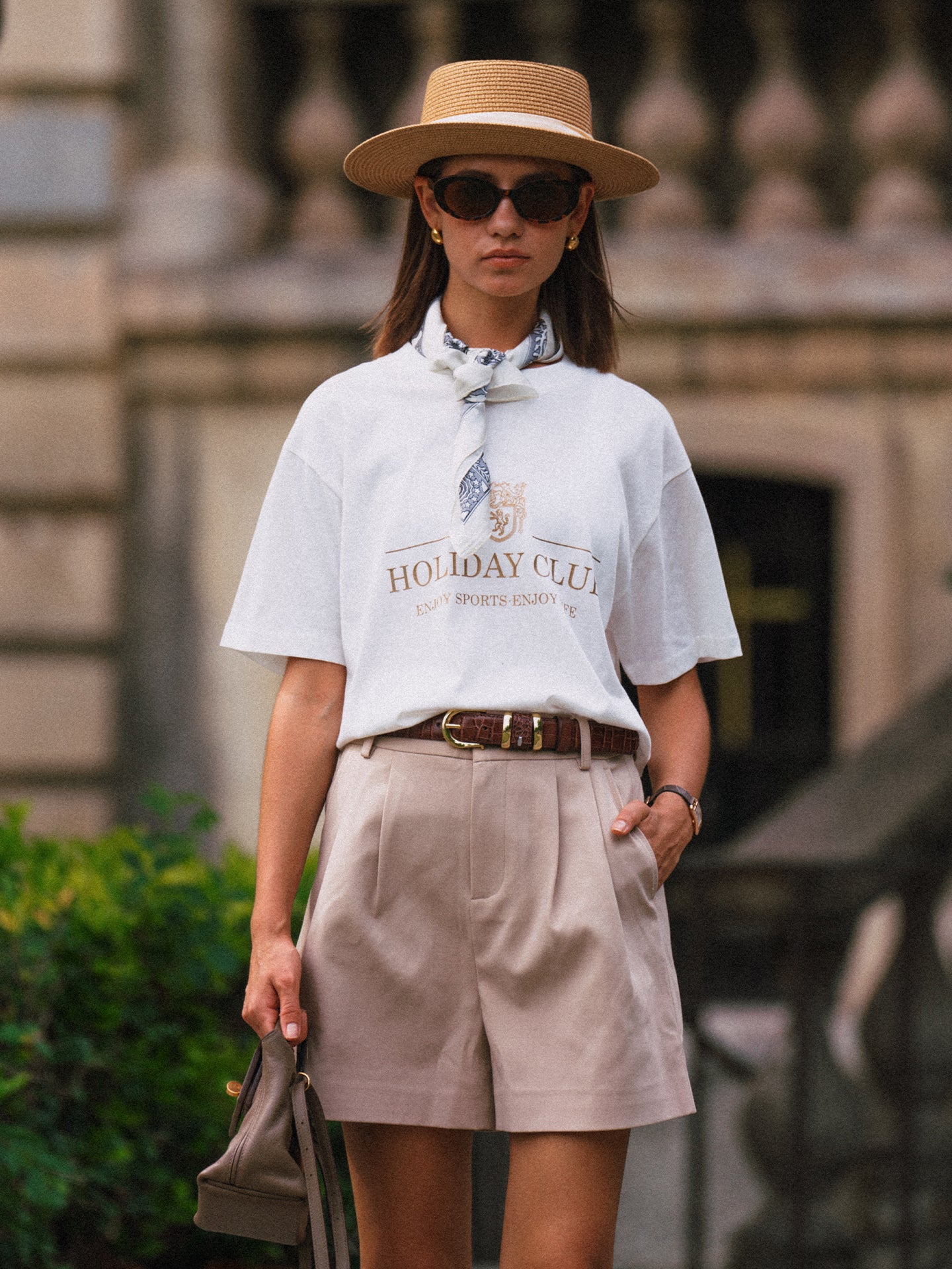 AROSRIS Princess Pleated Shorts in Beige — front view showing high-waist double pleat detail and fluid suiting drape