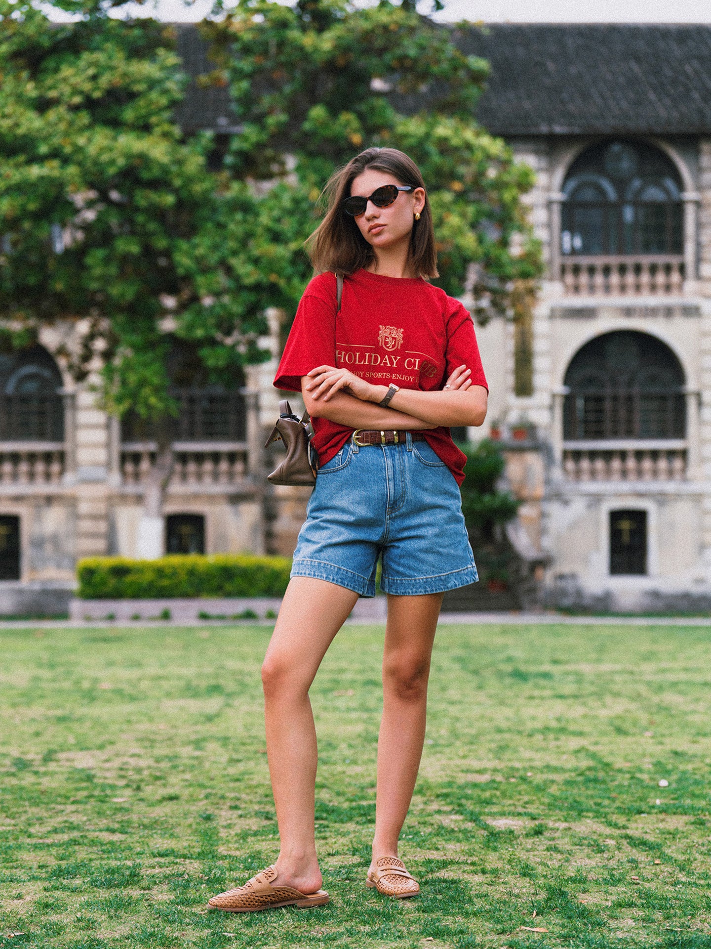 AROSRIS Princess A-Line Denim Shorts in Vintage Washed Blue — outdoor lifestyle shot showing vintage wash finish and flattering silhouette in motion