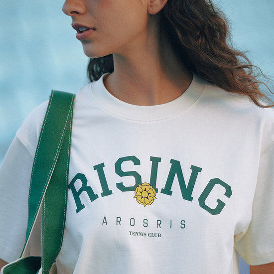 AROSRIS Retro Tennis Club Tee — outdoor lifestyle shot showing versatile silhouette and collegiate Rising print