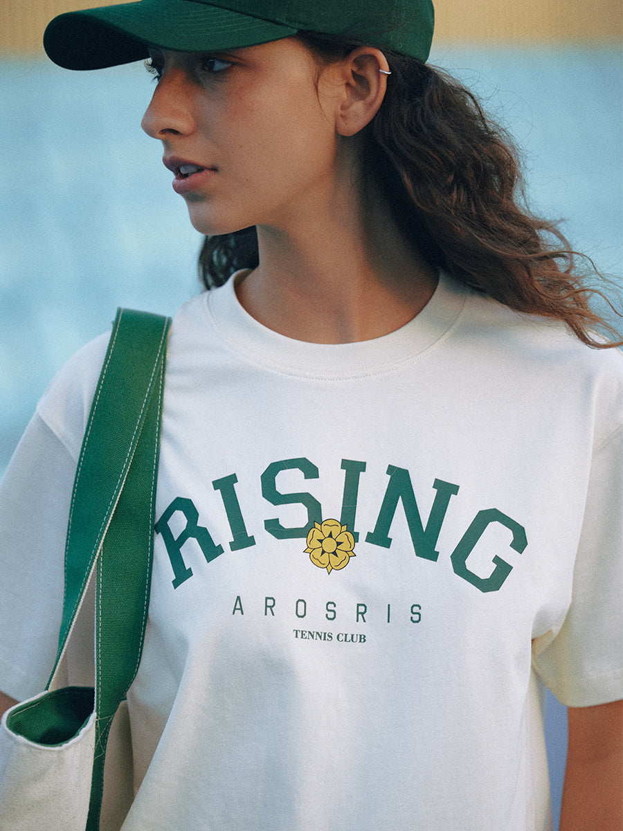 AROSRIS Retro Tennis Club Tee — outdoor lifestyle shot showing versatile silhouette and collegiate Rising print
