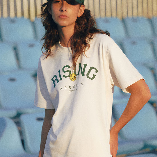 AROSRIS Rising Graphic Tee in Cream Beige — styled with cap and shorts showing Old Money sport aesthetic