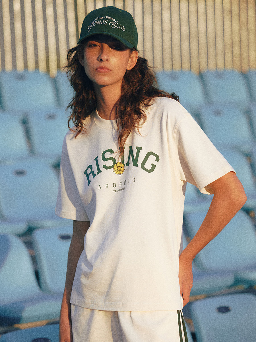 AROSRIS Rising Graphic Tee in Cream Beige — styled with cap and shorts showing Old Money sport aesthetic