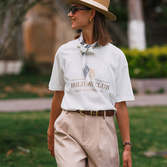 AROSRIS Princess Tailored Pleated Shorts in Beige — close-up showing belt loop waist detail and premium suiting blend fabric