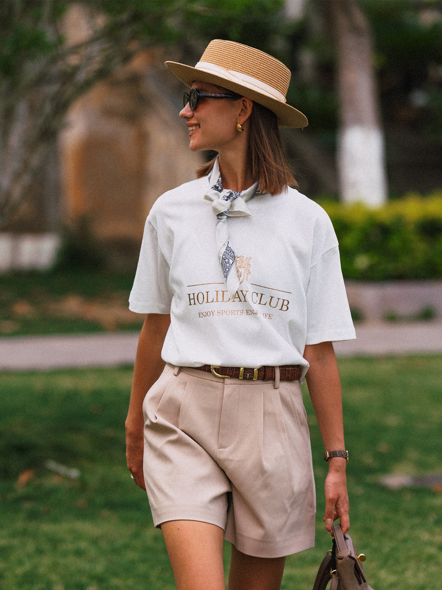 AROSRIS Princess Tailored Pleated Shorts in Beige — close-up showing belt loop waist detail and premium suiting blend fabric