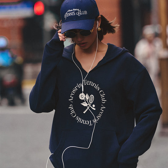 AROSRIS Tennis Club V-Neck Hoodie in Misty Navy — outdoor shot showing double-sided knit texture and hip-covering length
