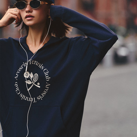 AROSRIS Tennis Club Vintage V-Neck Hoodie in Misty Navy — street style shot showing V-neck design and heritage graphic print