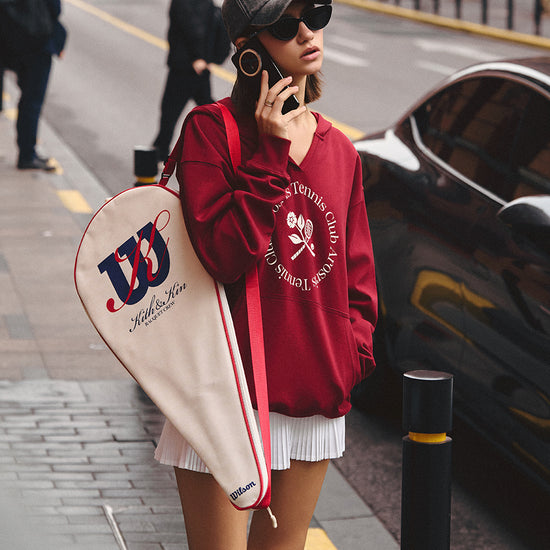 AROSRIS Tennis Club V-Neck Hoodie in Burgundy Wine — full body lifestyle shot showing relaxed fit and vintage campus aesthetic