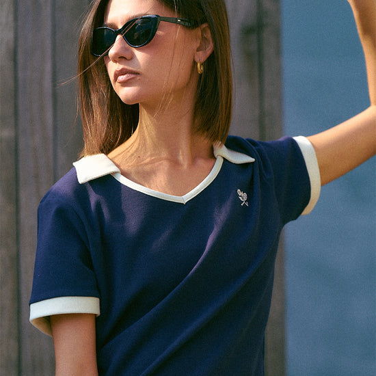 AROSRIS Tennis Club Contrast Polo in Quiet Navy — outdoor shot showing V-neckline and 3D waffle knit texture