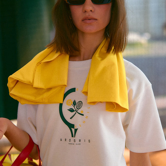 AROSRIS Morning Run Waffle Tee in yellow — full body outdoor lifestyle shot showing relaxed boyfriend fit