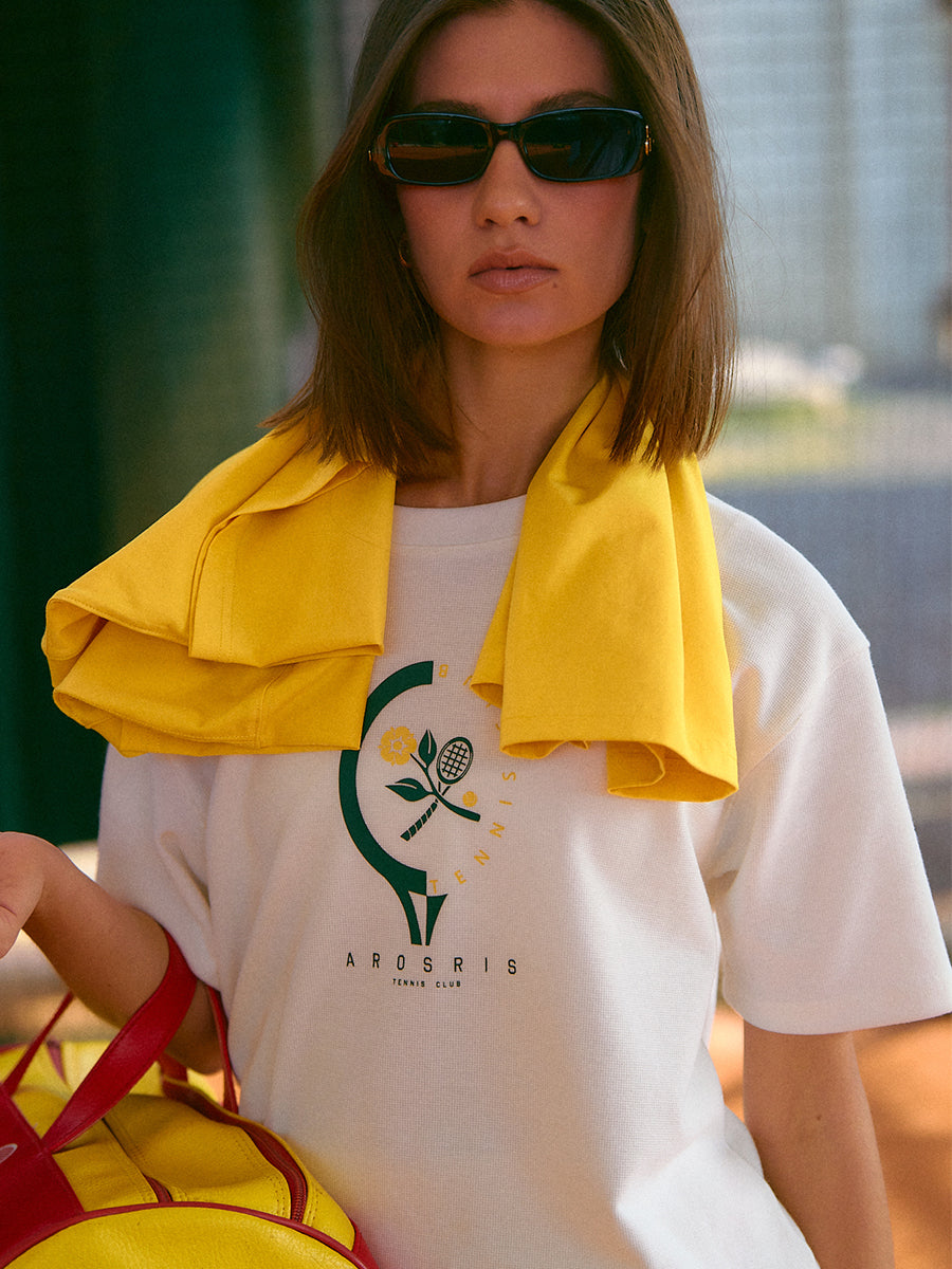 AROSRIS Morning Run Waffle Tee in yellow — full body outdoor lifestyle shot showing relaxed boyfriend fit