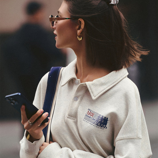 AROSRIS Tennis Club Polo Sweatshirt styled with high-waist bottoms — showing leg-lengthening cropped effect in Oatmeal Heather