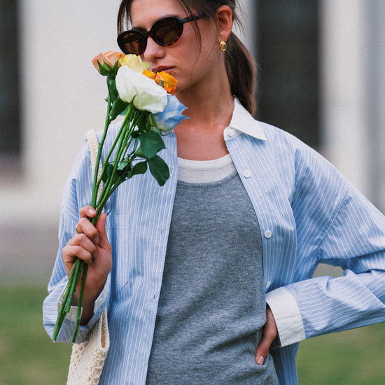 AROSRIS Four Seasons Wool Vest in Mist Grey — outdoor lifestyle shot showing layered styling with blazer and matching shorts