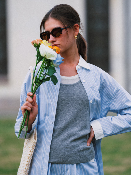 AROSRIS Four Seasons Wool Vest in Mist Grey — outdoor lifestyle shot showing layered styling with blazer and matching shorts