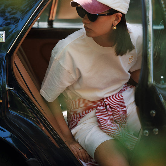 AROSRIS City Stroll Waffle Texture Cotton Tee in white — model wearing with pink shorts and cap, street style