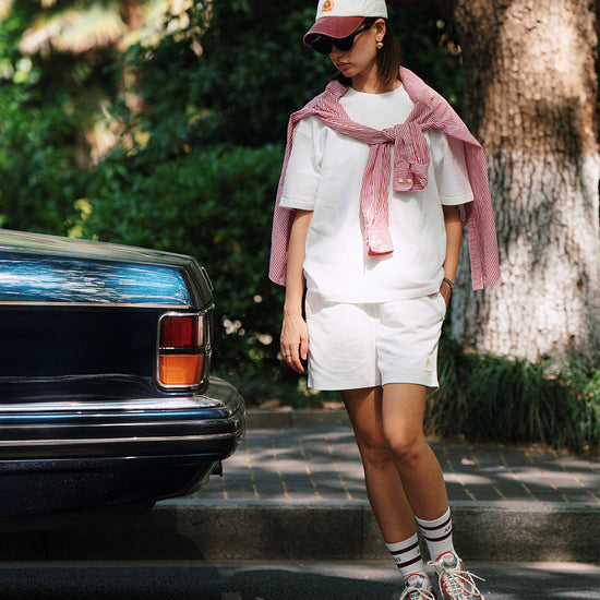 AROSRIS City Stroll Waffle Texture Shorts in white — full body street style showing mid-thigh length and clean fit