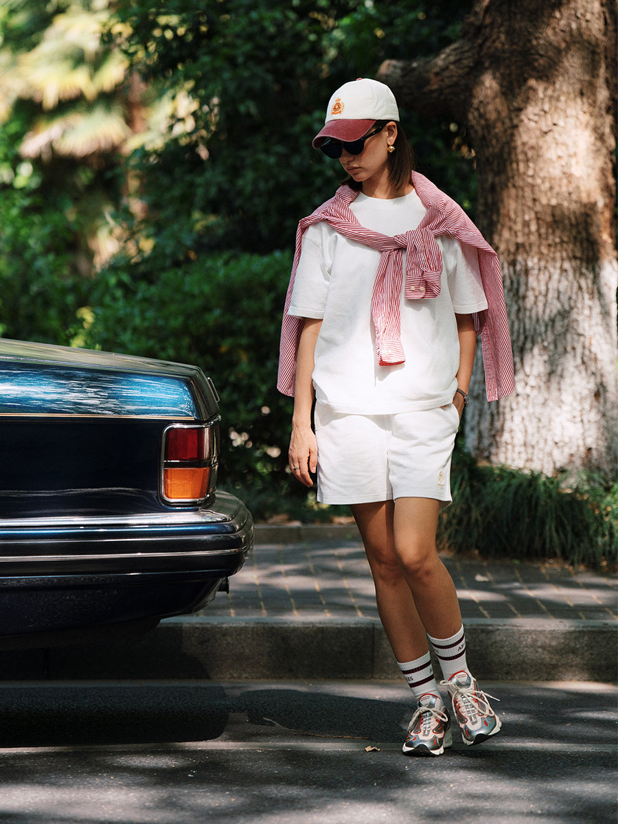 AROSRIS City Stroll Waffle Texture Shorts in white — full body street style showing mid-thigh length and clean fit