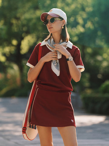 AROSRIS Tennis Club Retro Waffle Knit Skort in Passion Red — full body lifestyle shot showing A-line silhouette and waffle texture