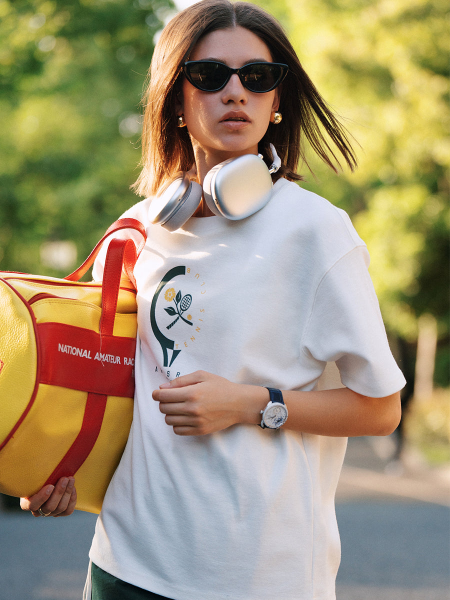 Close-up of AROSRIS Morning Run Waffle Tee in white — retro Tennis Series graphic print detail on chest