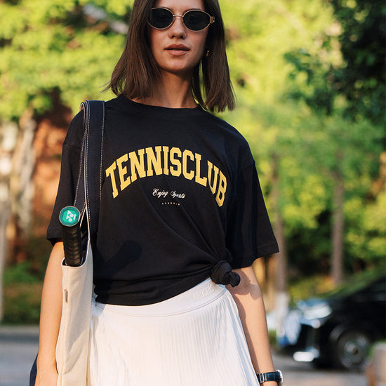 AROSRIS Tennis Club Graphic Tee in Midsummer White — full body street style showing relaxed oversized fit