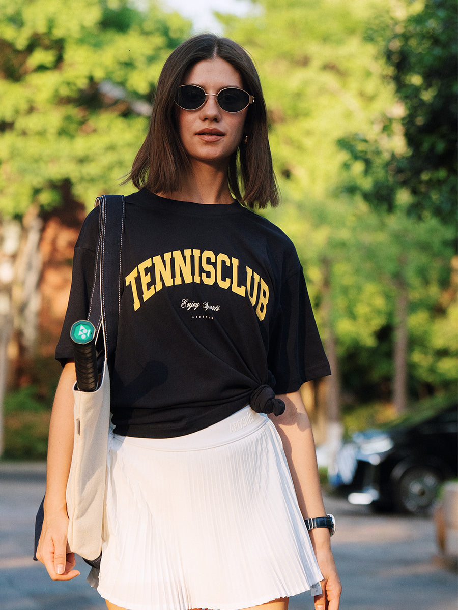 AROSRIS Tennis Club Graphic Tee in Midsummer White — full body street style showing relaxed oversized fit