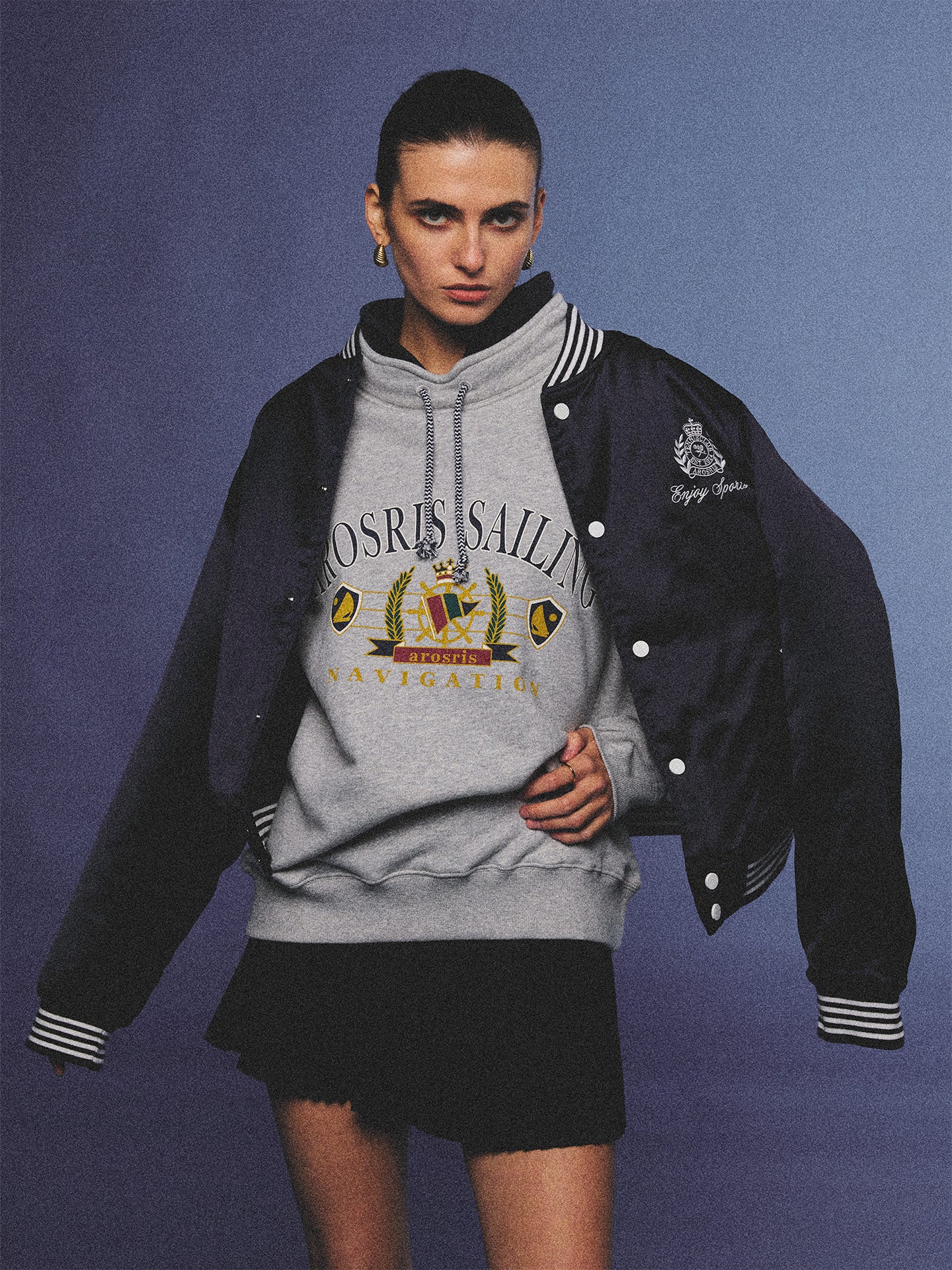 Arosris ash grey sailing navigation mock neck sweatshirt elegantly styled on a model, capturing an effortless 90s sporty-chic coastal yacht club aesthetic.